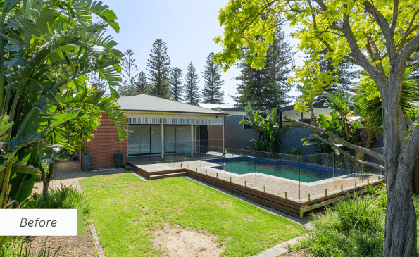 Adelaide bungalow backyard before renovation, showing the original brick exterior, lawn and swimming pool.